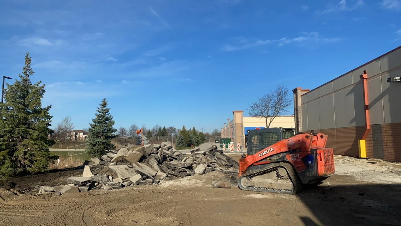 Concrete tear-out and removal on a commercial site with Kubota skid-steer