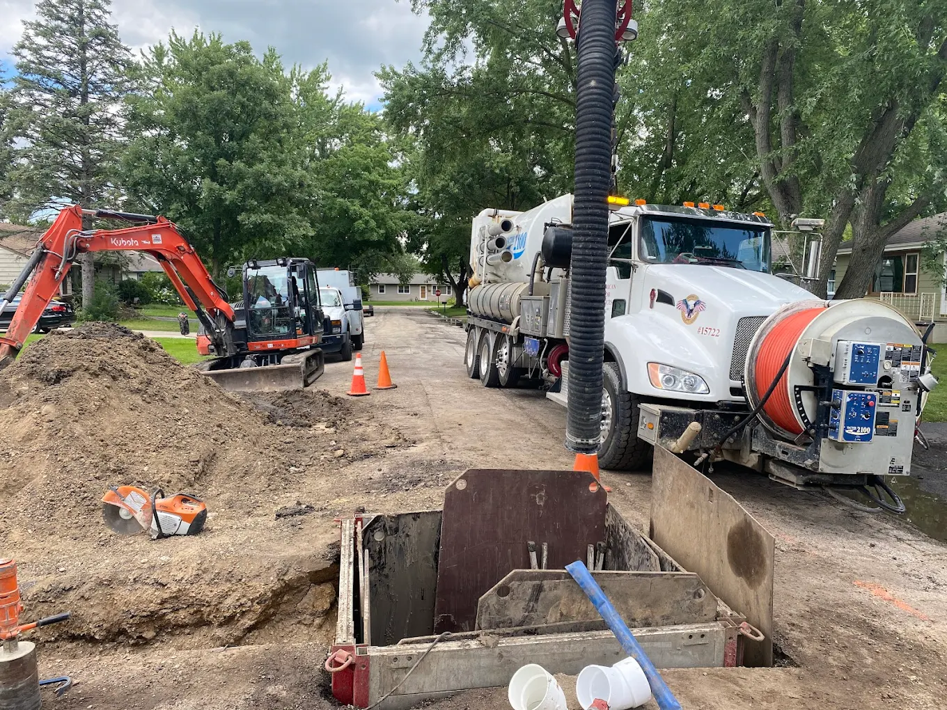 Sewer main tap and repair with trench box and service truck on-site